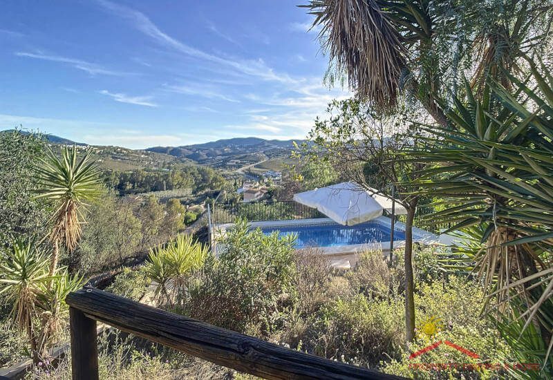 from the house terrace you can see the pool and the hill side of the Axarquía