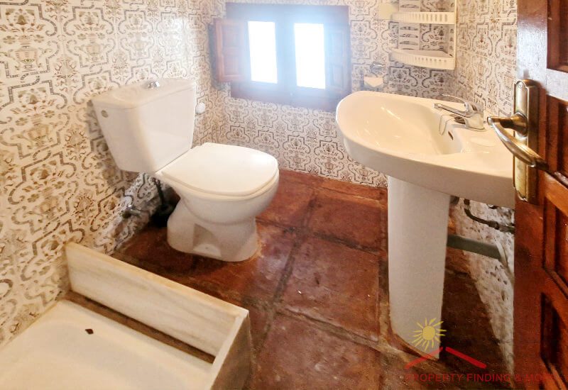 The shower room is small, but has a shower and window