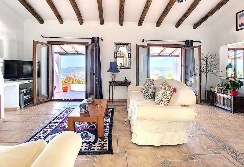 A wide salon with two big French doors with great views