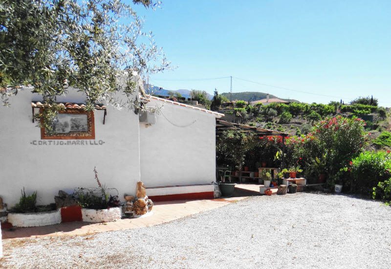 Parking area, house and view of Cortijo Marrillo to buy