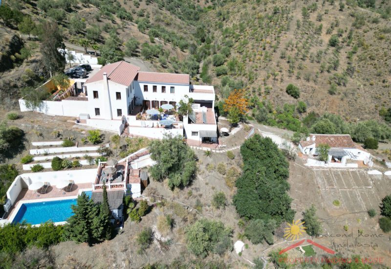 Pool view from above of Cortijo La Zapatera with terraces