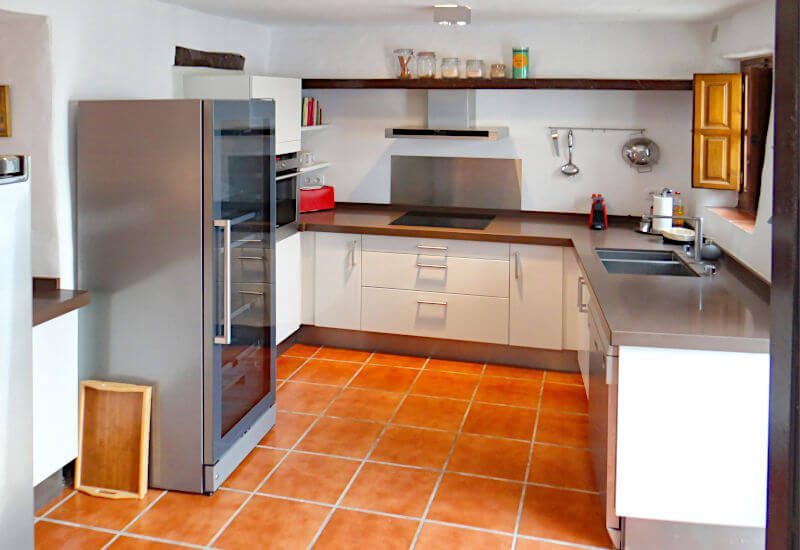 open fully equipped kitchen in a renovated townhouse in Andalusia
