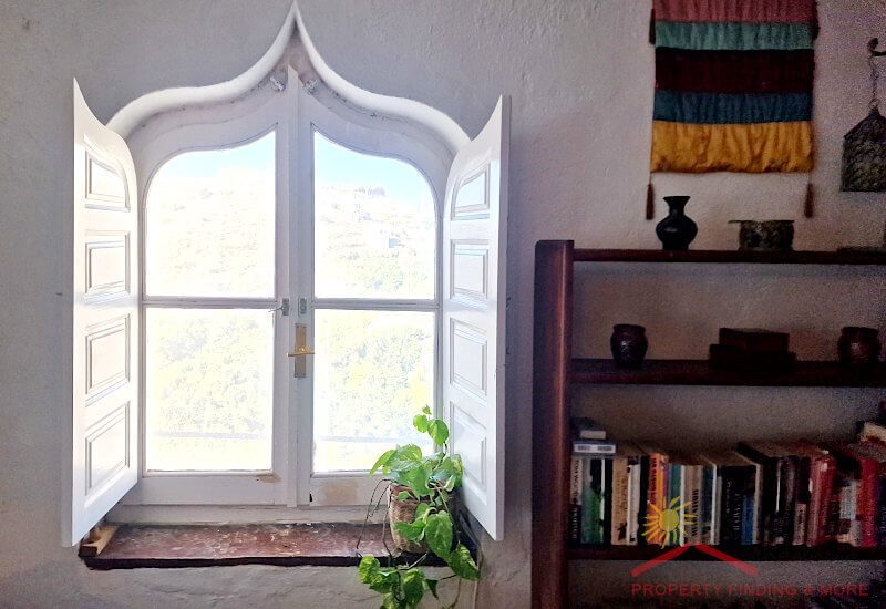 There is a Moroccan window in the sun room
