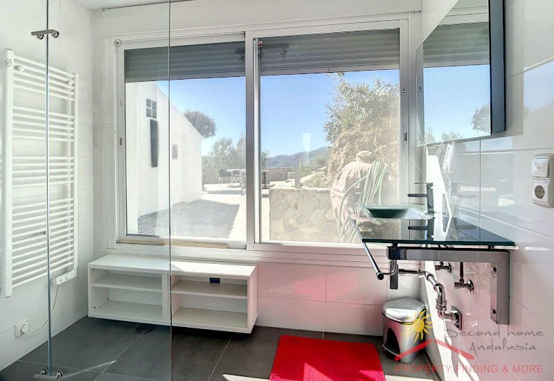 Bathroom with large windows and shower
