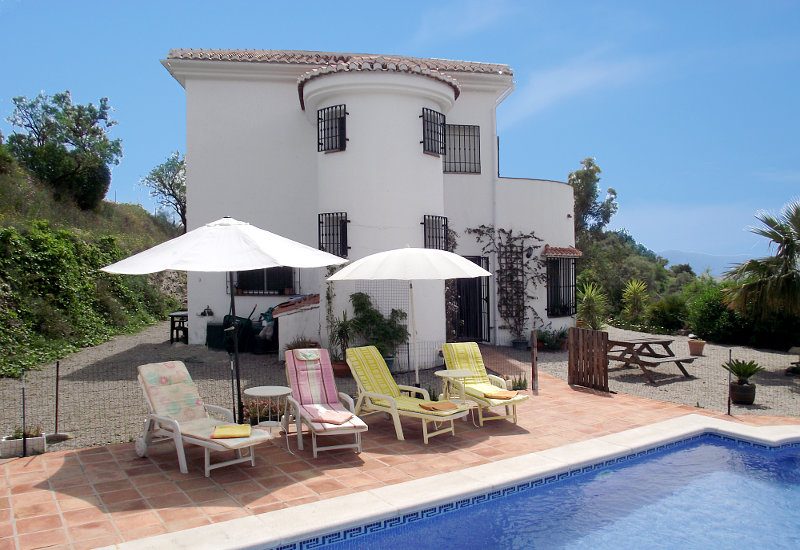 Pool with sunbath area around and a great view on the landscape.