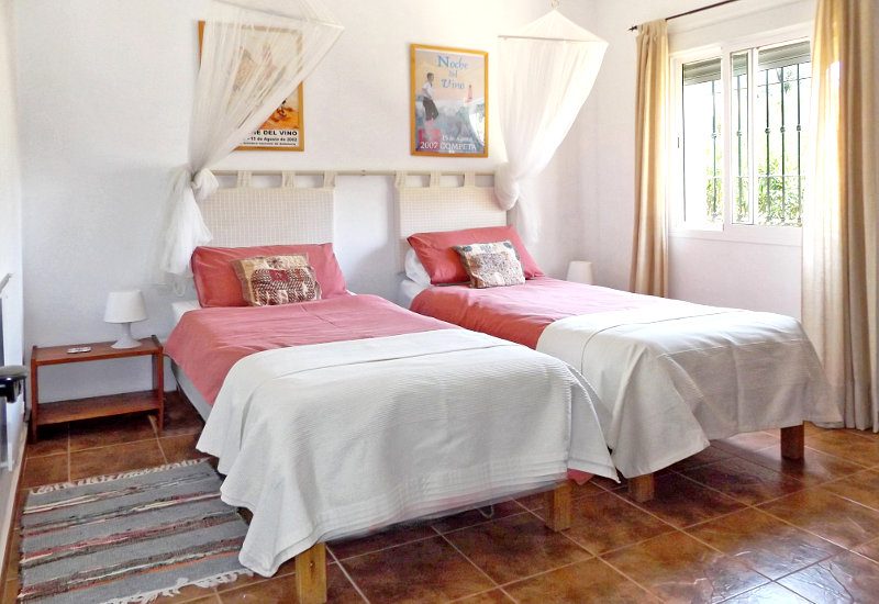 The guest bedroom has to beds and it's own window. Its spacious to walk around.