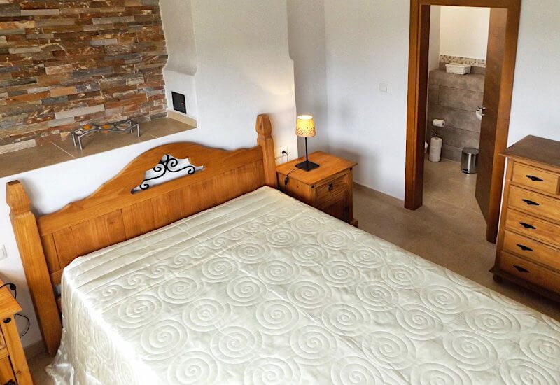 Bedroom 1 is heated by the chimnea and has direct access to the bathroom