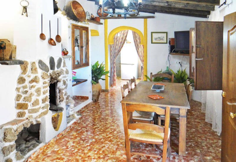 Lounge with fireplace and big table