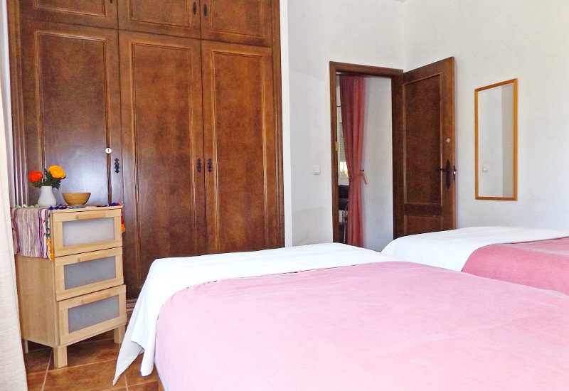 Guest bedroom with nice inbuilt wooden wardrobe. 