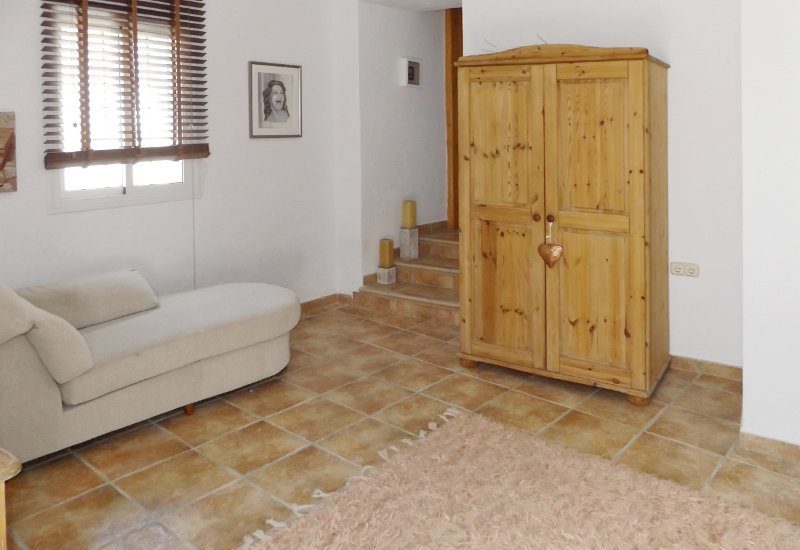 Studio with staircase to the upper rooms of Casa Montaña in Sedella