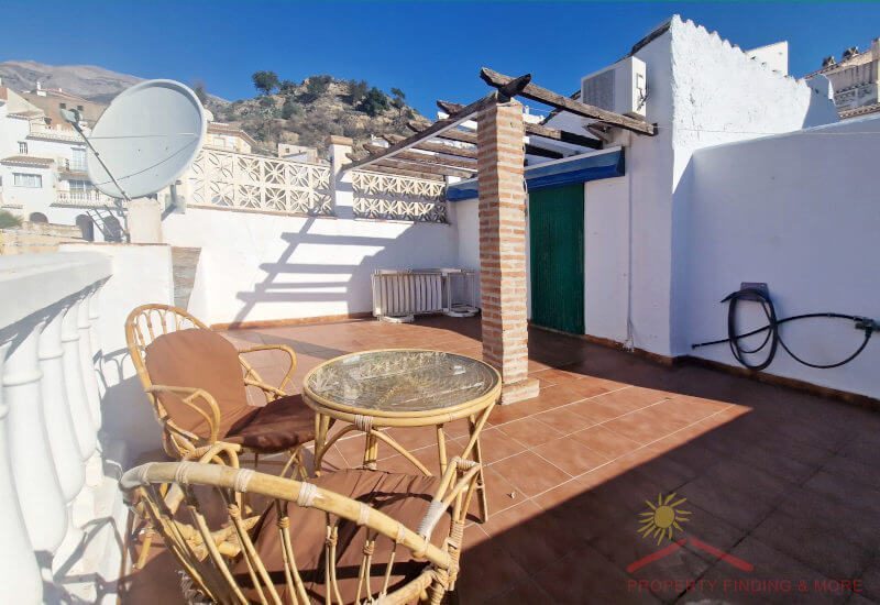 From the roof terrace you can see the roofs of the village