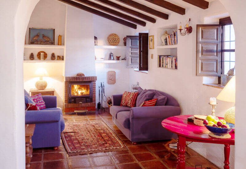 Living room with sofas and fireplace and built-in shelves