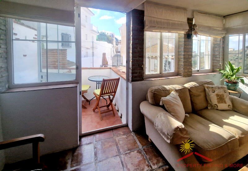 The sun room leads onto a small terrace