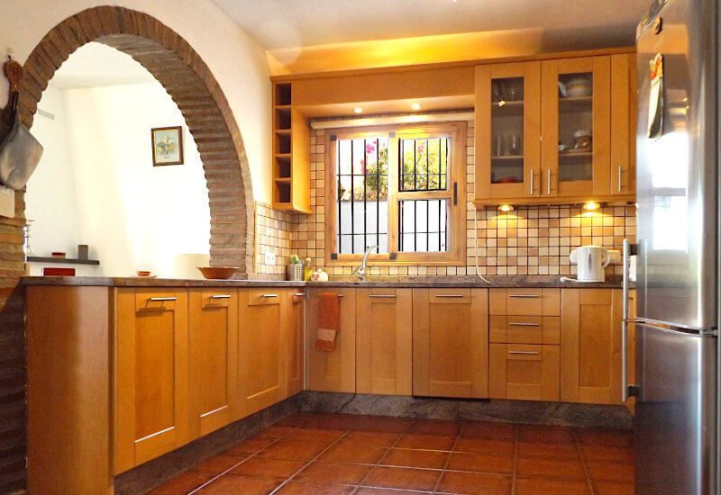 The open kitchen is fully equipped and has its own small window.