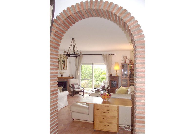 Lounge with view on chimney and terrace door to the garden