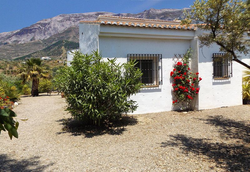 Front of Casa Churrispa in Sedella with Marroma mountain in the back.