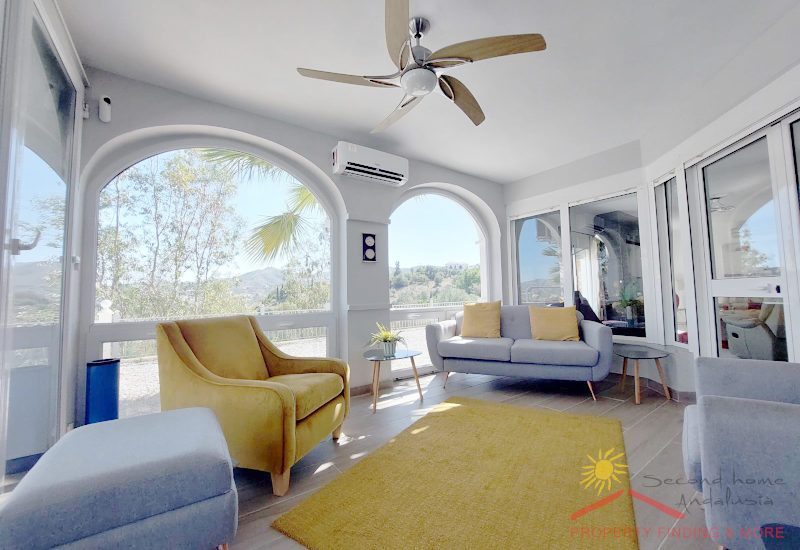 the winter room with sitting area and big windows