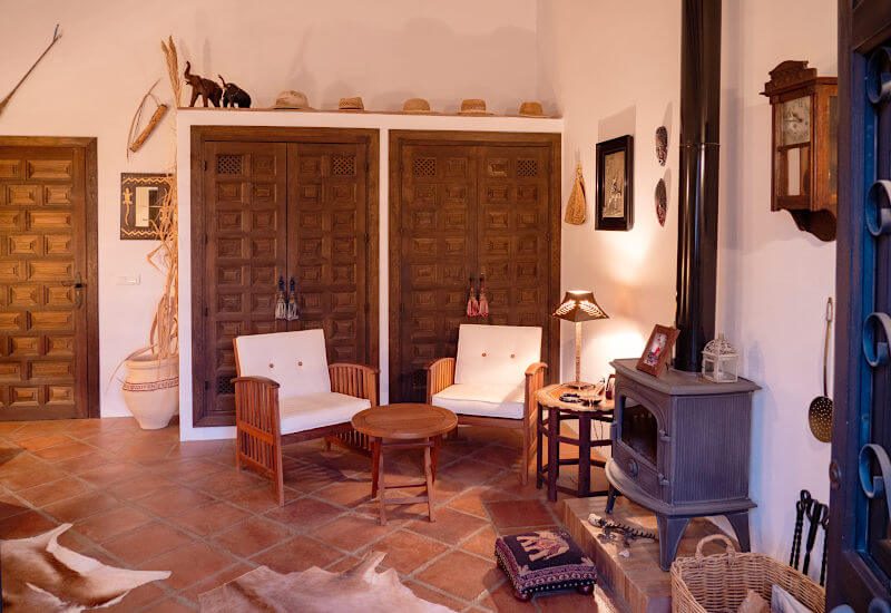 Salon with large wall cupboard, seating furniture and fireplace