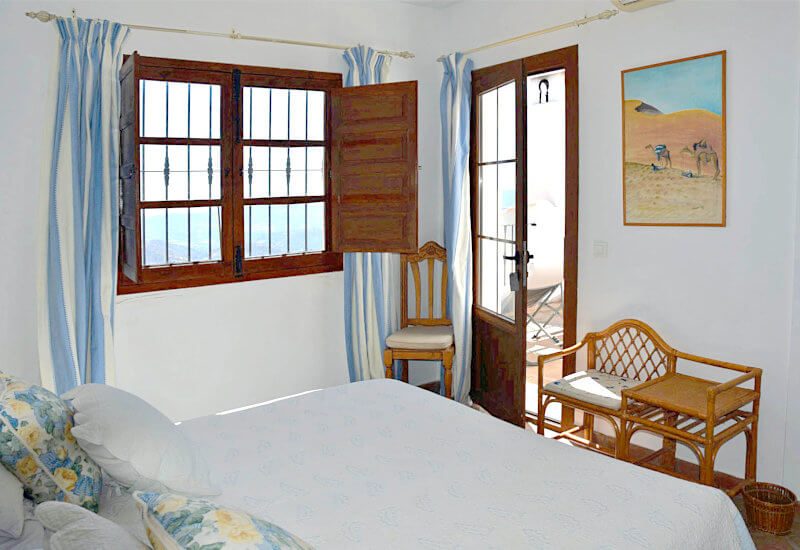 Bedroom 1 with kingsize bed, window and balcony door