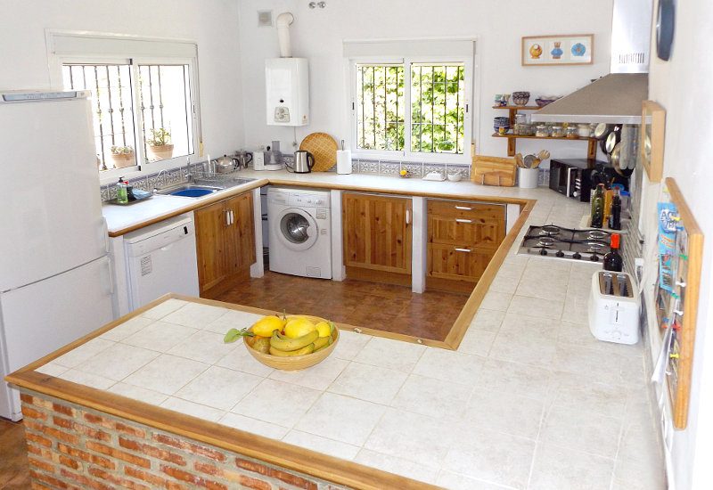 Fully equipped kitchen with two windows and a lot of space to work.