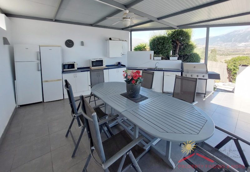 Fully equipped outdoor kitchen with BBQ and dining area and fantastic view