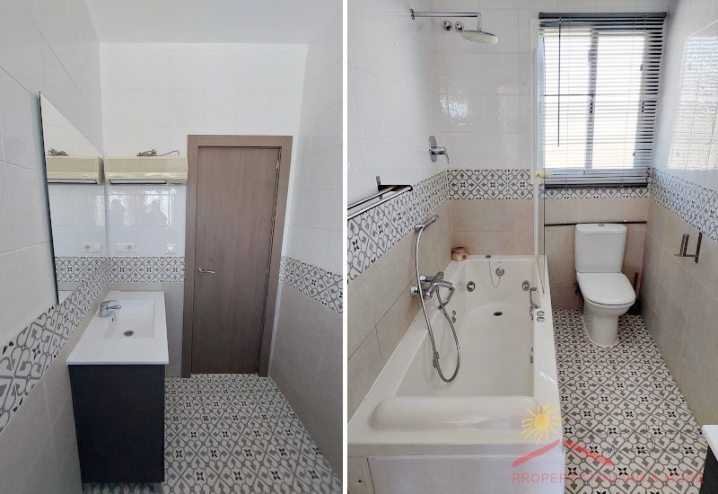 a smaller family bathroom with tube combinde shower a toilette, basin and window