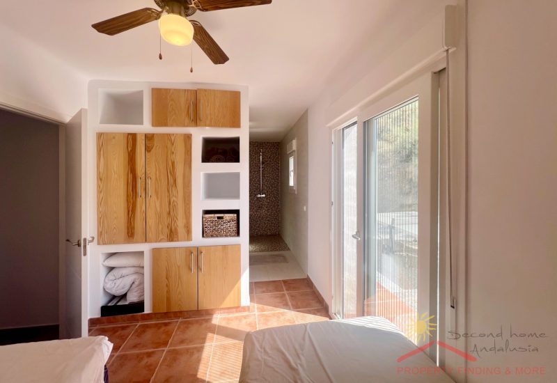 The twin guest room 2 beds and an in-build wardrobe