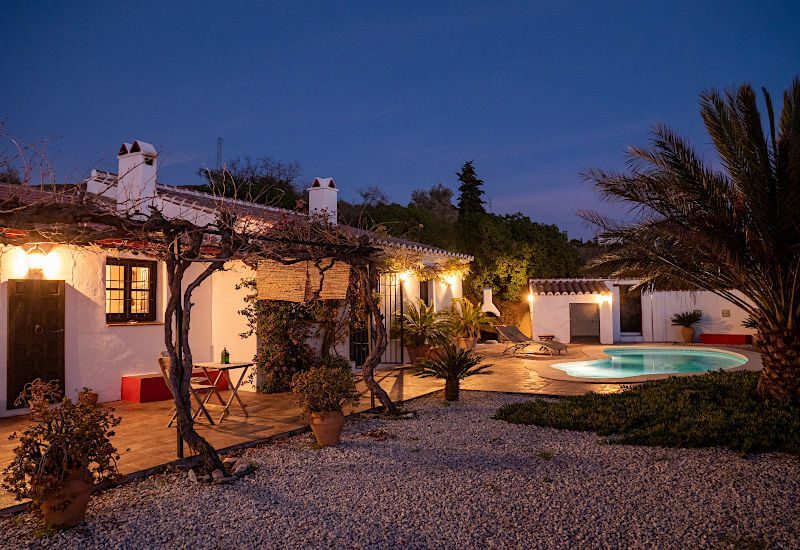 Photo of the Finca in the night with a light up romantic terrace