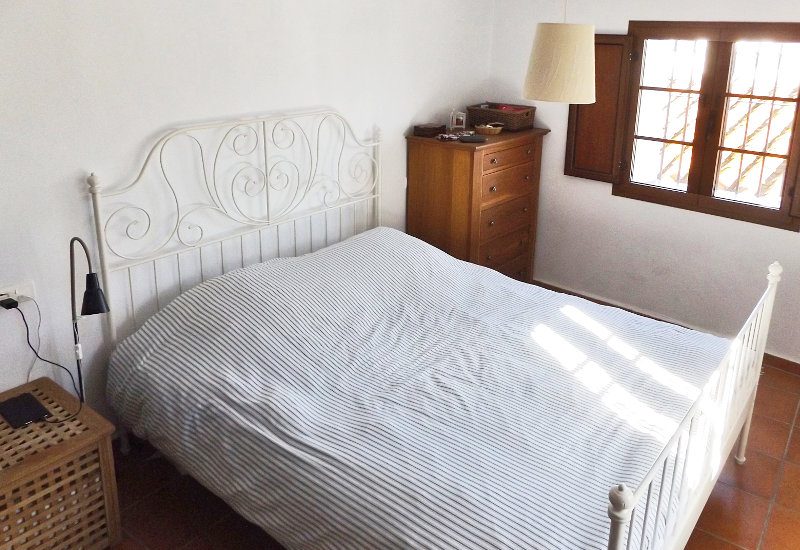 Spaceous master bedroom with window to two sides.