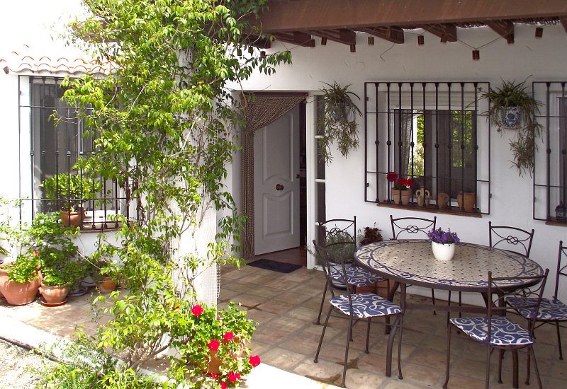 Typical terrace of Andalusia in the shadow with wine growing