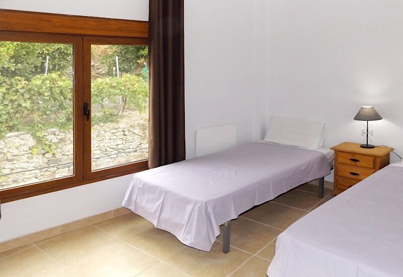 Bedroom 3 with a big window to the street.