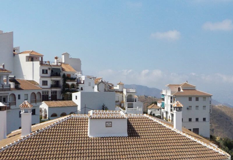 View from the balcony over the roofs Canillas de Aceituno