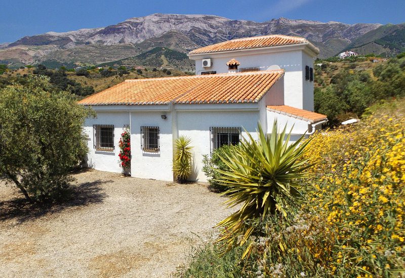 Casa Churrispa front elevation with parking place and view on Marroma