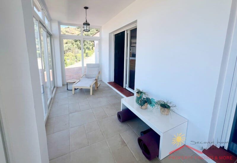 Winter room with modern plastic glass doors, tiled and accessible from the terrace