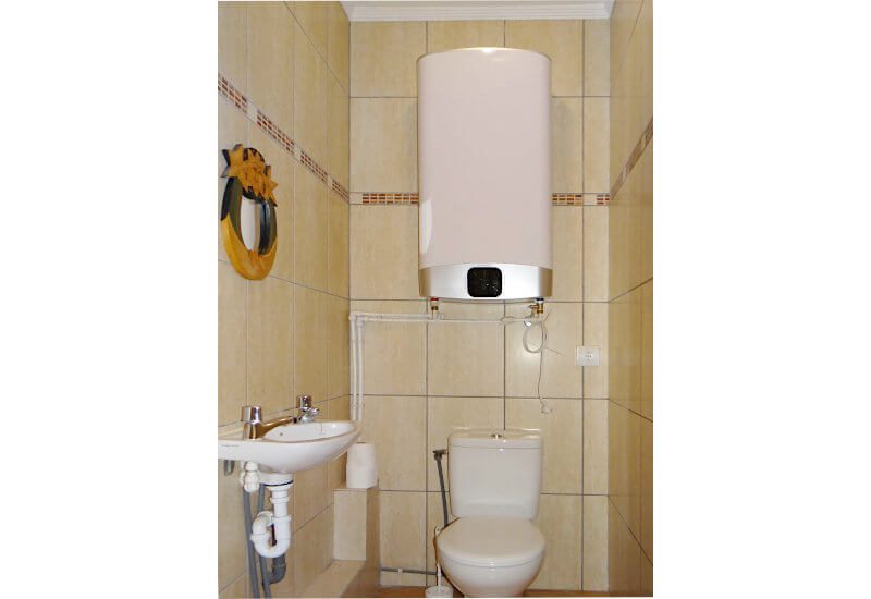 Extra toilet with small washbasin
