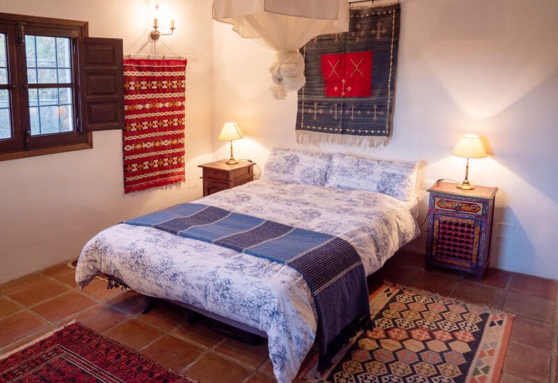 Bedroom A has a king size bed and nice wooden windows.