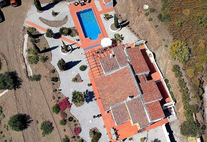 Spectacular top view of Casa Viña La Maroma from a drone.
