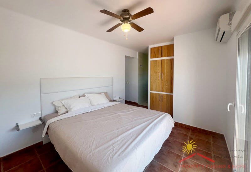 Guest room French bed with built-in wardrobe, fan and air conditioning