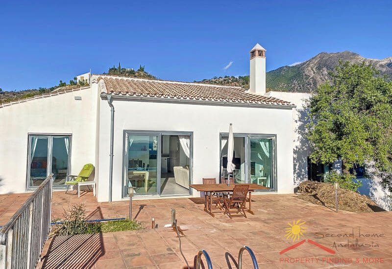 The big sun terrace is between the house and pool