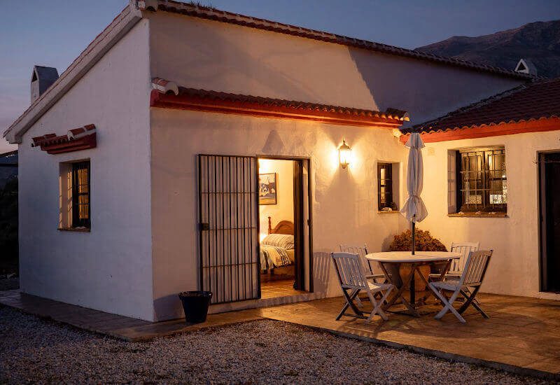 Terrace with sitting area in front of the guest bedroom in the night