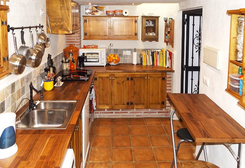 Kitchen with storage place and table.