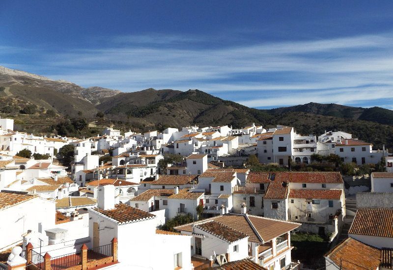 View of the typical Spanish white village of Sedella from the roof terrace