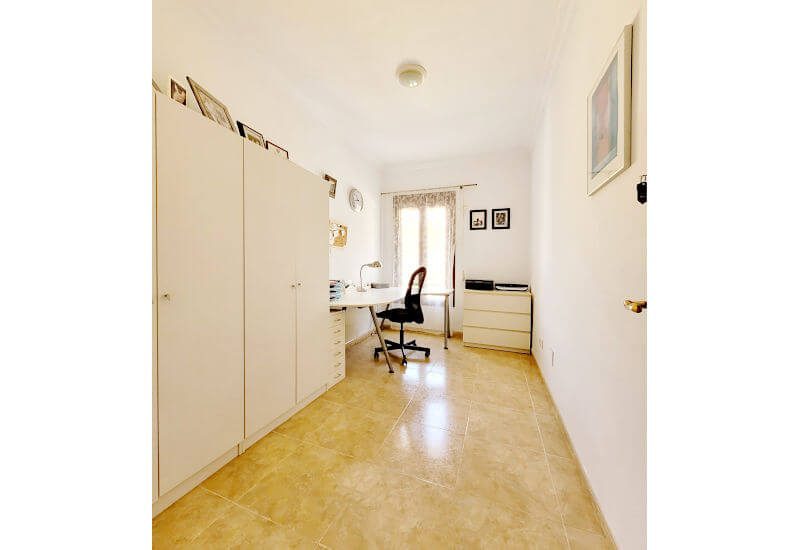 a big office room with a lot of cupboards