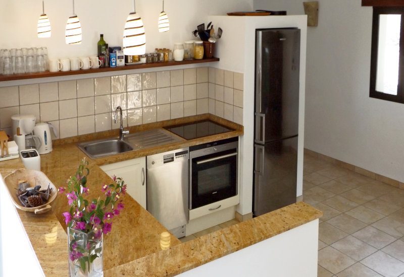 Photo of the full equipped kitchen with work places