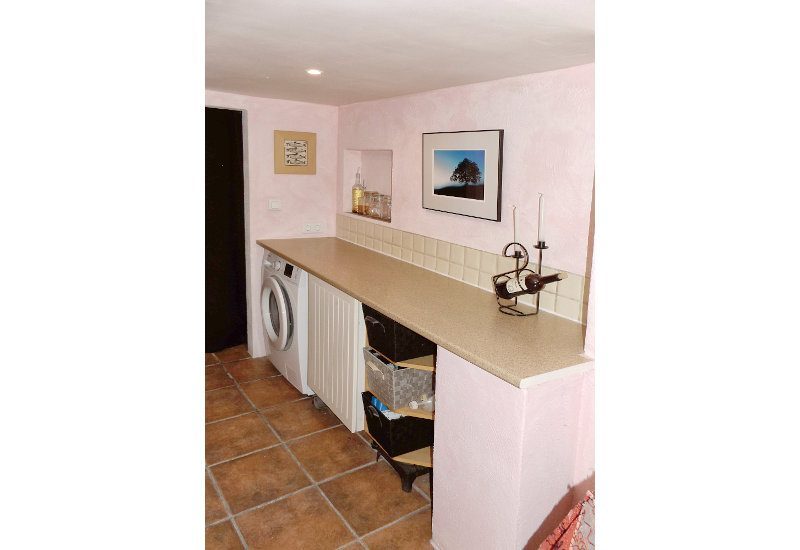 The utility room is accessed from the studio and has space for washing mashine and more.