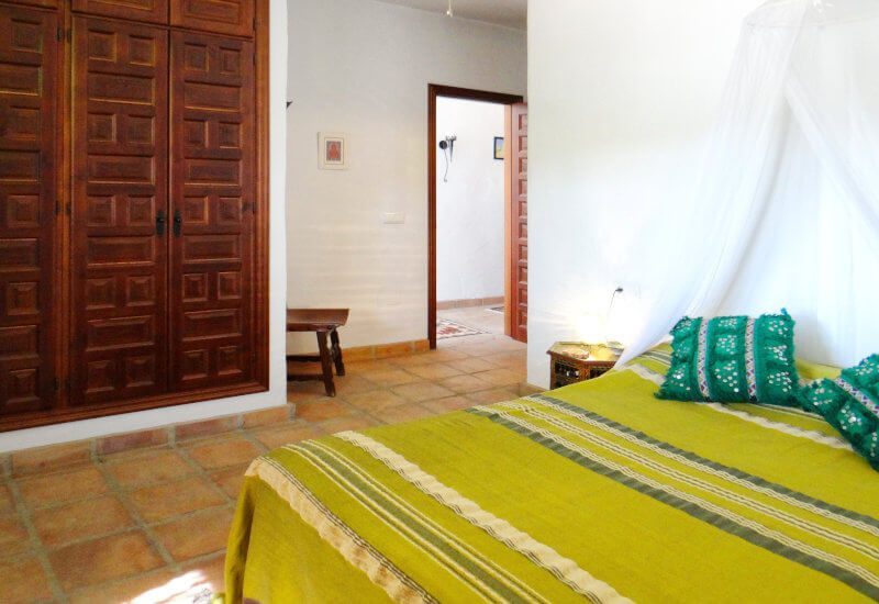 The green bedroom for guests offers a double size bed and a lot of space