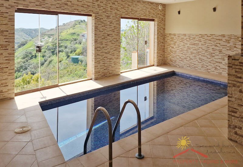 The pool room is illuminated by bright ceiling lights