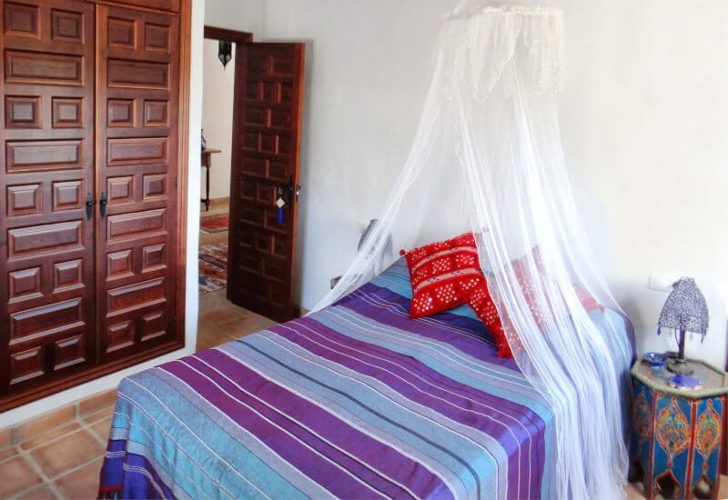 The master bedroom has a kingsize bed and an inbuild wardrobe