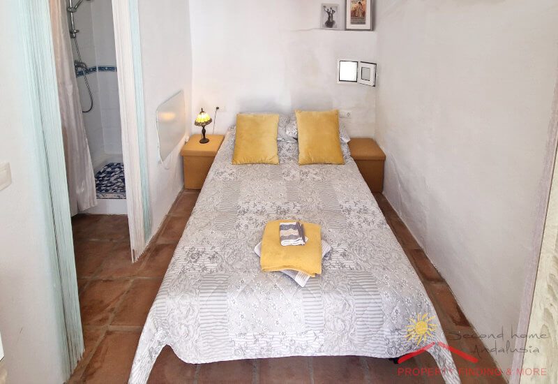 Small bedroom with big single bed and an en-suite bathroom