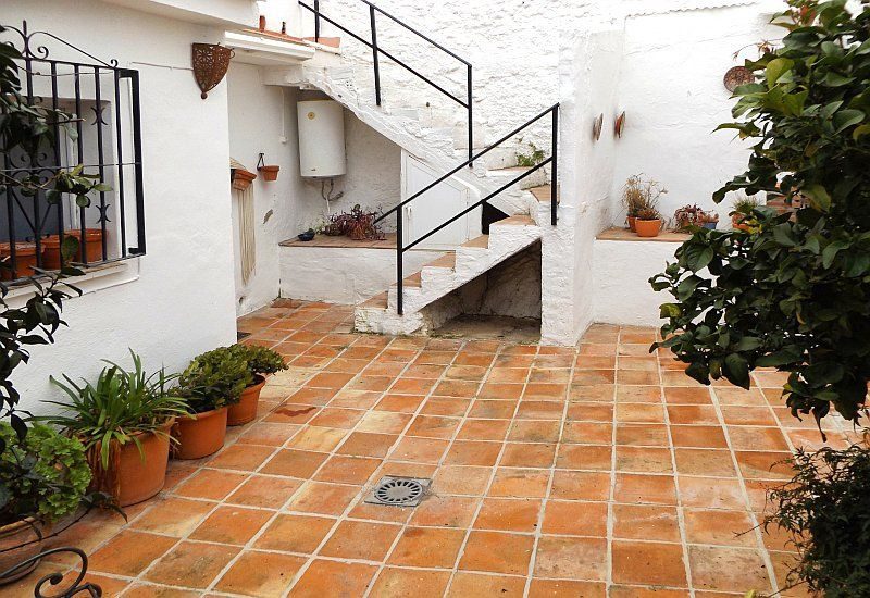 You have access from the kitchen to the terrace. A staircase leads to a further terrace.